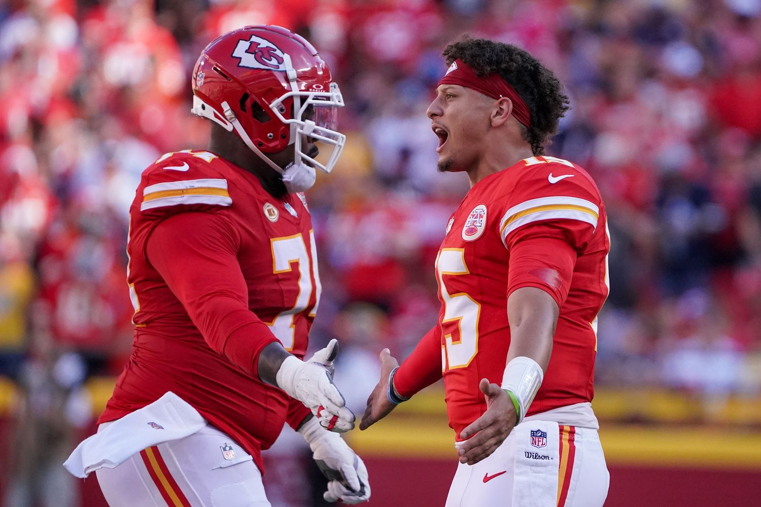 Sep 24, 2023; Kansas City, Missouri, USA; Kansas City Chiefs quarterback Patrick Mahomes (15) congratulates Kansas City Chiefs offensive tackle Jawaan Taylor (74) after a score during the first half at GEHA Field at Arrowhead Stadium. Mandatory Credit: Denny Medley-USA TODAY Sports